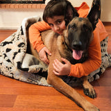 This Vienna Cozy Cave Dog Bed is a faux fur dog bed that's perfect for your pup. It has a soft, warm and cozy design that will make your furry friend feel right at home.