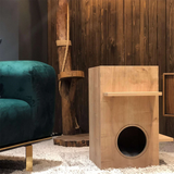 this is a wooden cat house made from high quality wood, with a small opening for the cats to get inside.