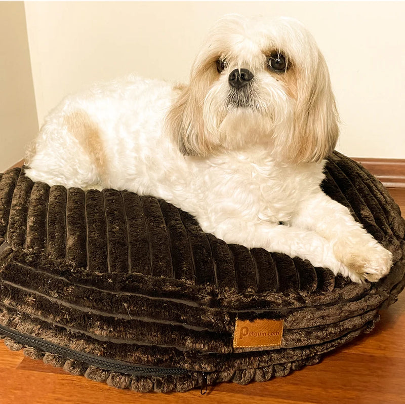 The Macaron Calming Dog Bed’s cover is made of 100% cotton, making it machine washable.