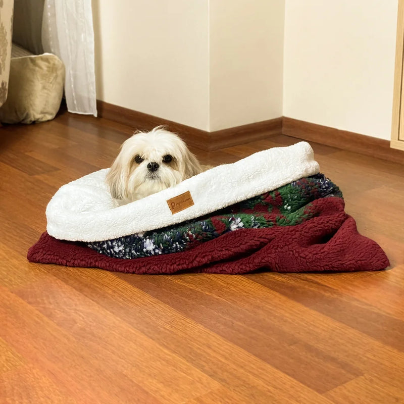 A cozy cave dog bed made from soft faux fur fabric and a sturdy foam core, it's durable and cozy for even winter.