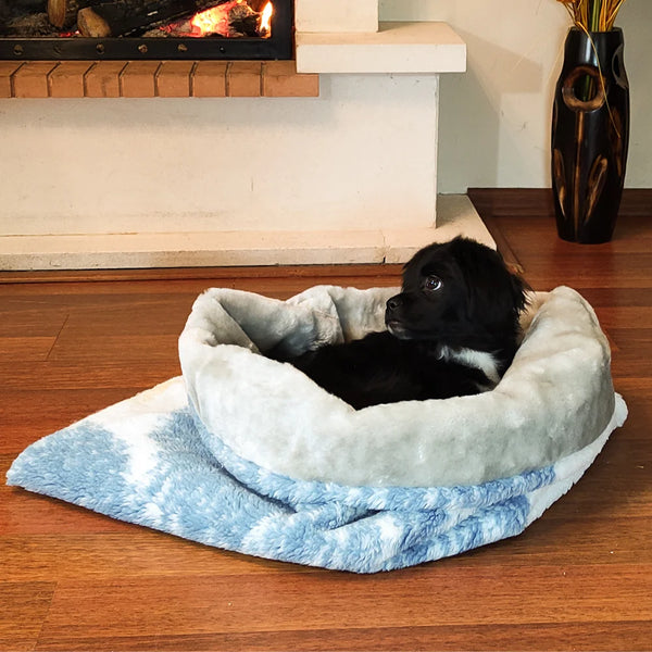The Oslo Cozy Cave Dog Bed is a washable dog bed that looks like a cave. It's perfect for your dog to sleep in and snuggle up in.