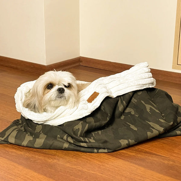 The Jasper Camouflage dog cave bed large is a large, washable dog bed with a camouflage pattern.