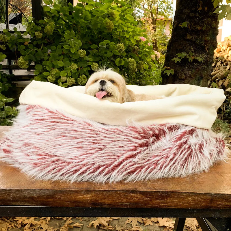 The Dorian Faux Fur Dog Bed is the perfect place for your pup to curl up and relax. With a plush faux fur cover and waterproof bottom, this dog bed is both stylish and durable.